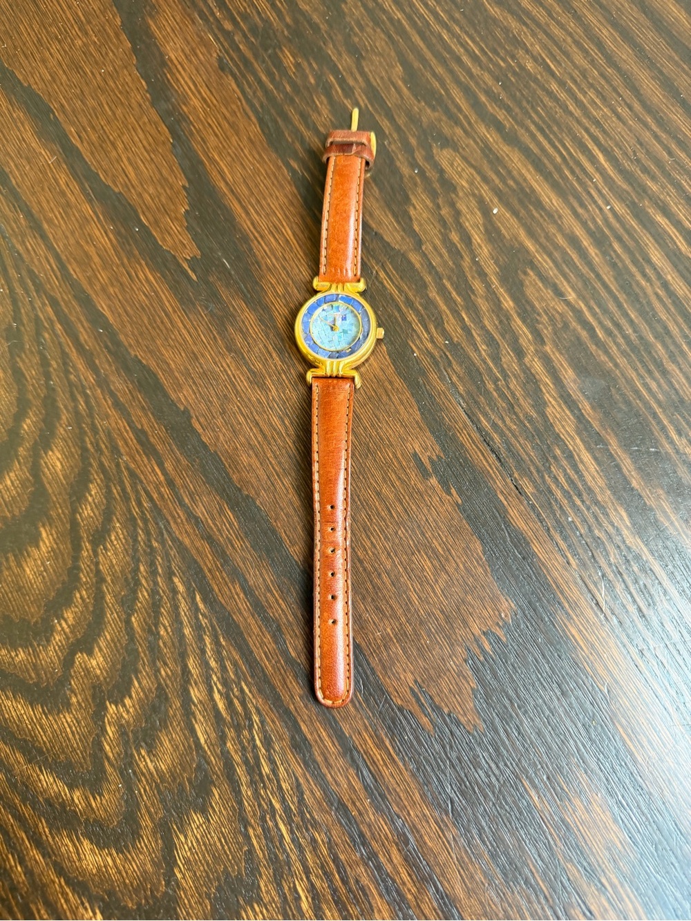 Vintage Fossil watch with a brown leather strap.